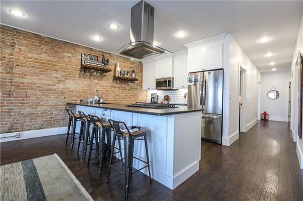 Interior, Kitchen, Recessed Lighting, Stainless Steel Appliances, Stone Walls, Wood Texture Flooring