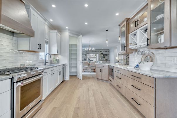 Chandelier, Interior, Kitchen, Pendant Lights, Recessed Lighting, Stainless Steel Appliances, Wood Texture Flooring