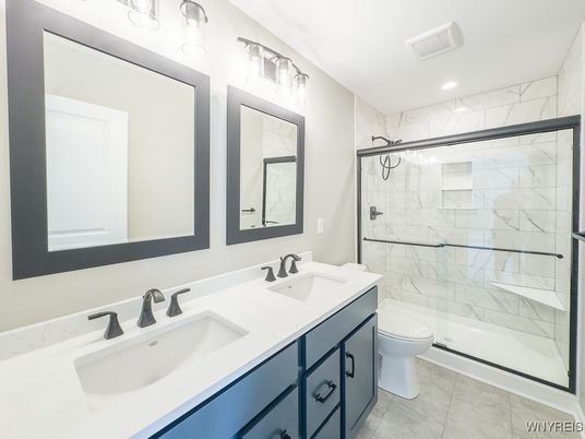 Bathroom, Dual Sink Vanities, Glass Shower, Interior, Marble Walls, Recessed Lighting