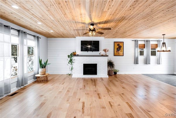 Empty room, Fireplace, Interior, Pendant Lights, Recessed Lighting, Wooden Ceilings, Wood Texture Flooring