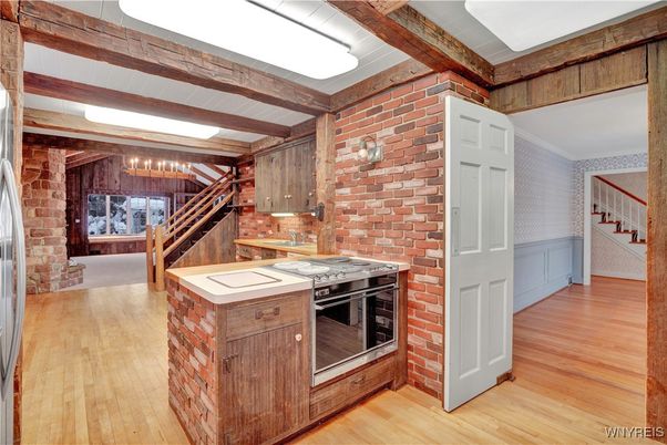 Fireplace, Interior, Kitchen, Stainless Steel Appliances, Stone Walls, Wooden Beams, Wood Texture Flooring