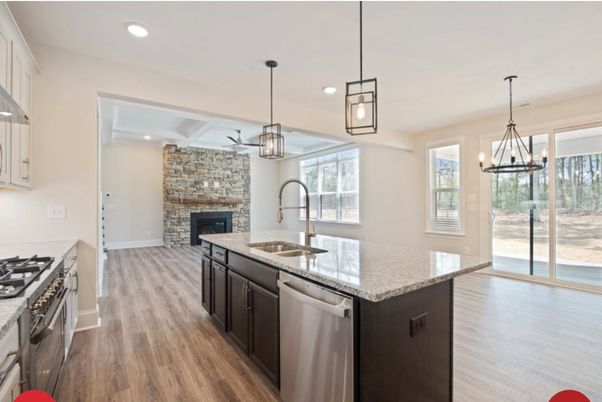 Fireplace, Interior, Kitchen, Pendant Lights, Recessed Lighting, Stainless Steel Appliances, Stone Walls, Wood Texture Flooring