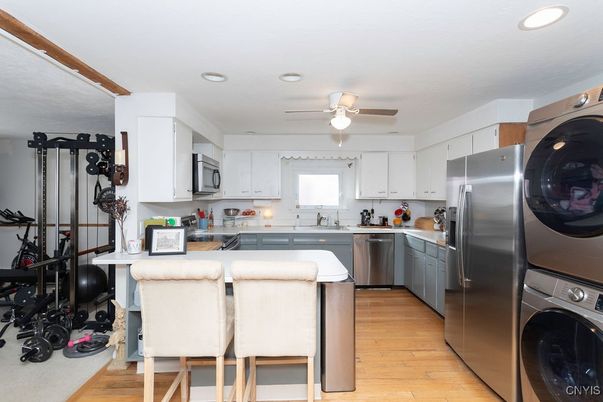 Interior, Kitchen, Recessed Lighting, Stainless Steel Appliances, Washer, Wood Texture Flooring