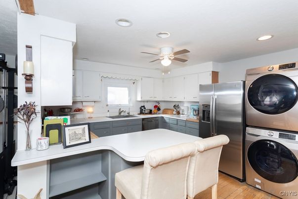 Interior, Kitchen, Recessed Lighting, Washer, Wood Texture Flooring