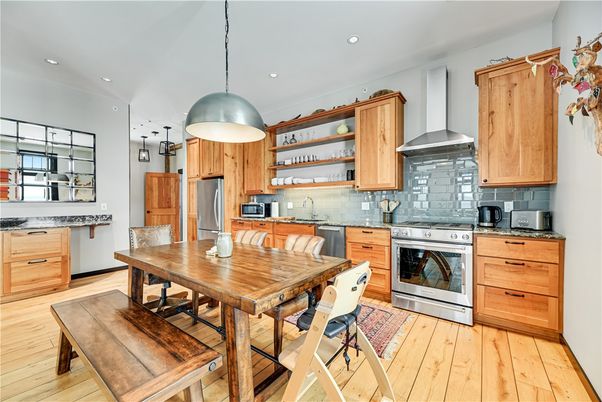Dining room, Interior, Kitchen, Pendant Lights, Recessed Lighting, Stainless Steel Appliances, Wood Texture Flooring