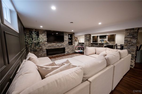 Fireplace, Interior, Kitchen, Living room, Recessed Lighting, Stone Walls, Wood Texture Flooring