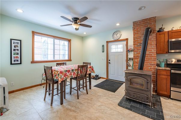 Dining room, Fireplace, Interior, Kitchen, Recessed Lighting, Stainless Steel Appliances, Stone Walls