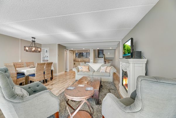 Chandelier, Dining room, Fireplace, Interior, Kitchen, Living room, Pendant Lights, Recessed Lighting, Wood Texture Flooring