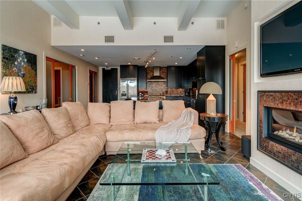Fireplace, Interior, Kitchen, Living room, Recessed Lighting, Stainless Steel Appliances, Stone Walls