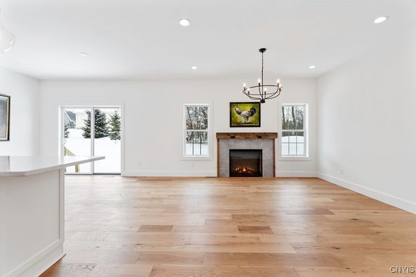 Chandelier, Empty room, Fireplace, Interior, Recessed Lighting, Wood Texture Flooring
