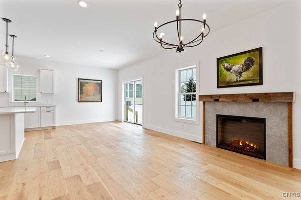 Chandelier, Empty room, Fireplace, Interior, Pendant Lights, Recessed Lighting, Wood Texture Flooring