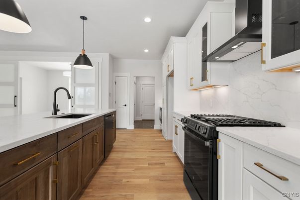 Interior, Kitchen, Marble Walls, Pendant Lights, Recessed Lighting, Stainless Steel Appliances, Wood Texture Flooring