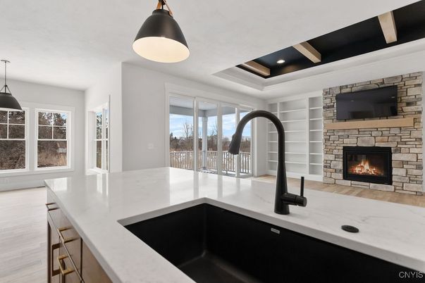 Fireplace, Interior, Kitchen, Pendant Lights, Recessed Lighting, Stone Walls, Wood Texture Flooring