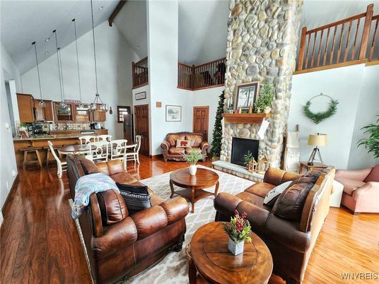 Dining room, Fireplace, Interior, Kitchen, Living room, Pendant Lights, Stone Walls, Wood Texture Flooring
