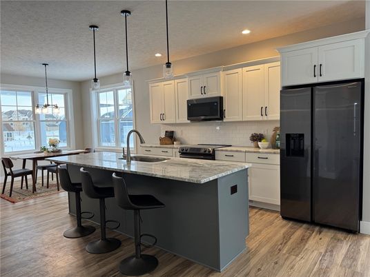 Dining room, Interior, Kitchen, Pendant Lights, Recessed Lighting, Stainless Steel Appliances, Wood Texture Flooring