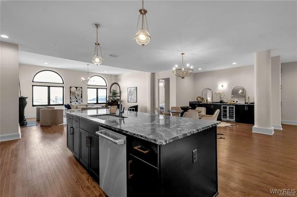 Chandelier, Dining room, Interior, Kitchen, Living room, Pendant Lights, Recessed Lighting, Stainless Steel Appliances, Wood Texture Flooring