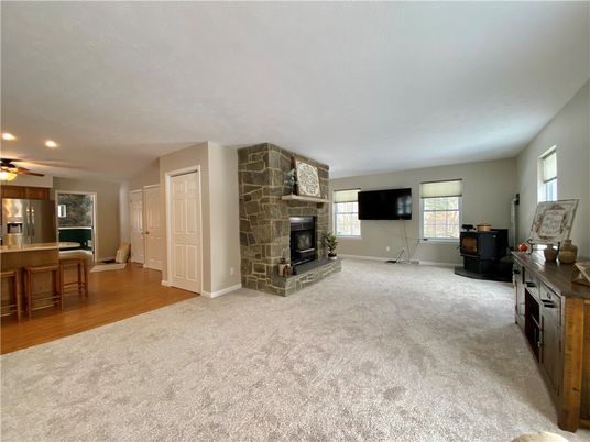 Dining room, Fireplace, Interior, Recessed Lighting, Stone Walls, Wood Texture Flooring