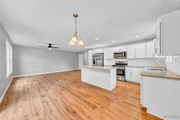 Chandelier, Interior, Kitchen, Pendant Lights, Recessed Lighting, Stainless Steel Appliances, Wood Texture Flooring