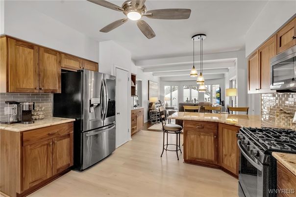 Dining room, Interior, Kitchen, Pendant Lights, Stainless Steel Appliances, Wood Texture Flooring