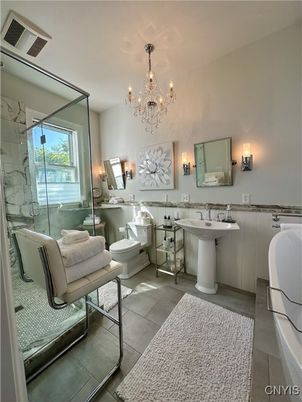 Bathroom, Chandelier, Dual Sink Vanities, Glass Shower, Interior, Marble Walls