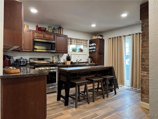 Interior, Kitchen, Recessed Lighting, Stainless Steel Appliances, Stone Walls, Wood Texture Flooring