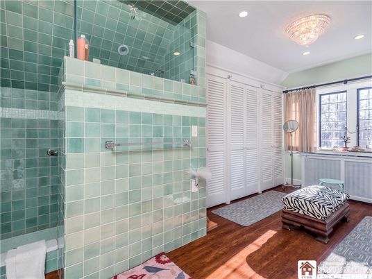Bathroom, Chandelier, Glass Shower, Interior, Recessed Lighting, Wood Texture Flooring
