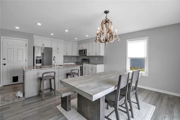 Chandelier, Dining room, Interior, Kitchen, Recessed Lighting, Stainless Steel Appliances, Wood Texture Flooring