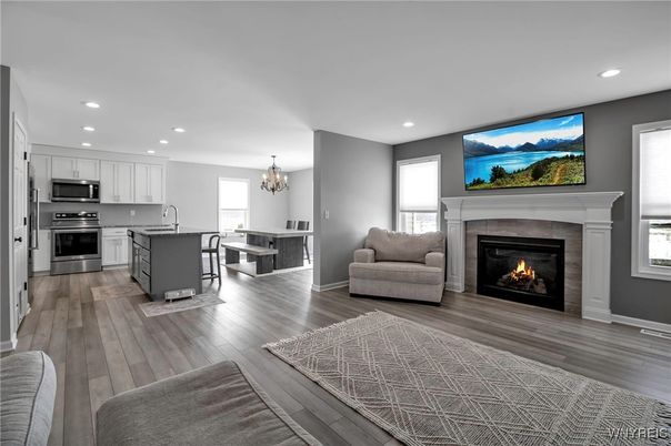 Chandelier, Dining room, Fireplace, Interior, Kitchen, Recessed Lighting, Stainless Steel Appliances, Wood Texture Flooring