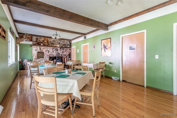 Dining room, Fireplace, Interior, Living room, Pendant Lights, Wooden Beams, Wood Texture Flooring