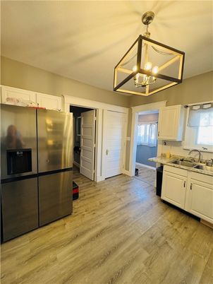 Interior, Kitchen, Pendant Lights, Stainless Steel Appliances, Wood Texture Flooring