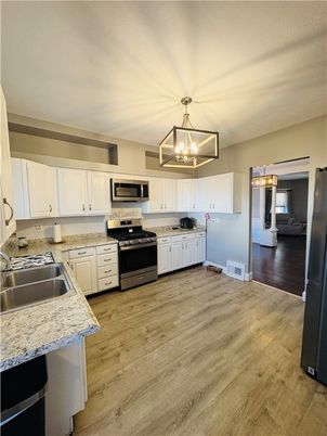 Interior, Kitchen, Pendant Lights, Stainless Steel Appliances, Wood Texture Flooring