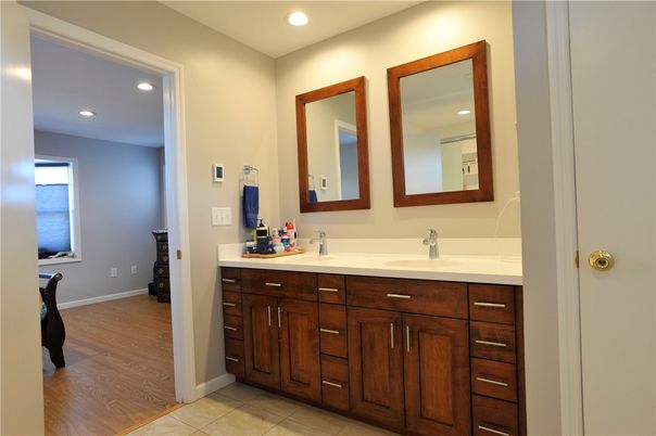 Bathroom, Dual Sink Vanities, Interior, Recessed Lighting, Wood Texture Flooring