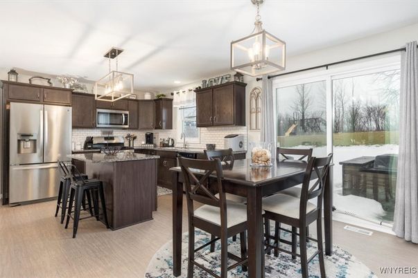 Dining room, Interior, Kitchen, Pendant Lights, Recessed Lighting, Stainless Steel Appliances, Wood Texture Flooring