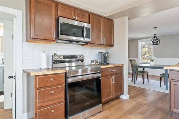 Dining room, Interior, Kitchen, Pendant Lights, Stainless Steel Appliances, Wood Texture Flooring