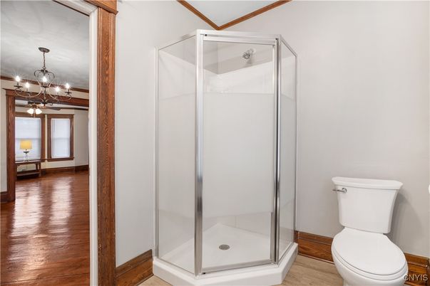 Bathroom, Chandelier, Glass Shower, Interior, Pendant Lights, Wood Texture Flooring