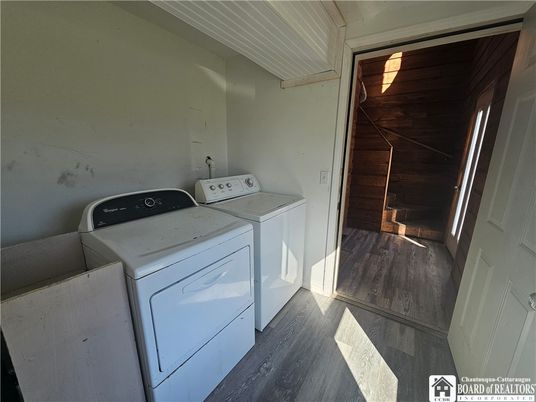 Interior, Utility Closets, Washer, Wood Texture Flooring, Wooden Walls