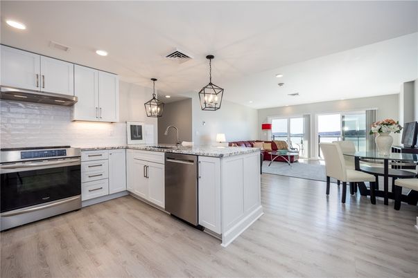 Dining room, Interior, Kitchen, Living room, Pendant Lights, Recessed Lighting, Stainless Steel Appliances, Wood Texture Flooring