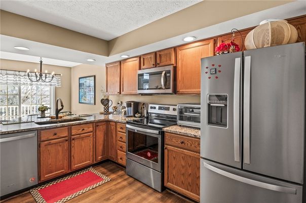 Chandelier, Interior, Kitchen, Recessed Lighting, Stainless Steel Appliances, Wood Texture Flooring