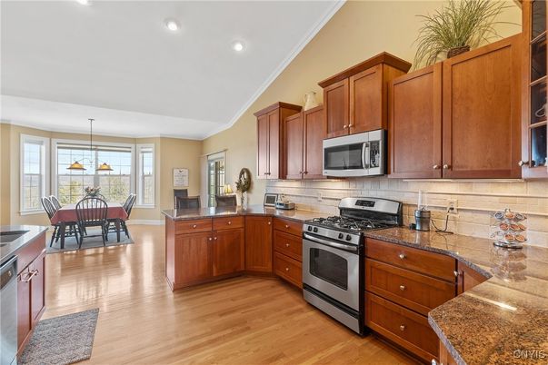 Dining room, Interior, Kitchen, Pendant Lights, Recessed Lighting, Stainless Steel Appliances, Wood Texture Flooring