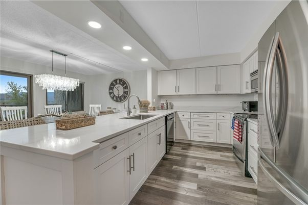 Chandelier, Dining room, Interior, Kitchen, Recessed Lighting, Stainless Steel Appliances, Wood Texture Flooring