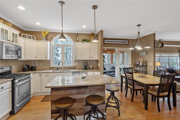 Dining room, Interior, Kitchen, Pendant Lights, Recessed Lighting, Stainless Steel Appliances, Wood Texture Flooring