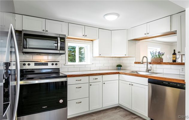 Interior, Kitchen, Stainless Steel Appliances, Tile Countertops, Wood Texture Flooring