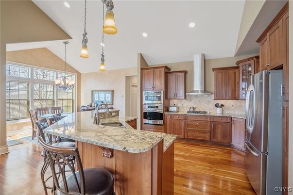 Chandelier, Dining room, Interior, Kitchen, Pendant Lights, Recessed Lighting, Stainless Steel Appliances, Wood Texture Flooring