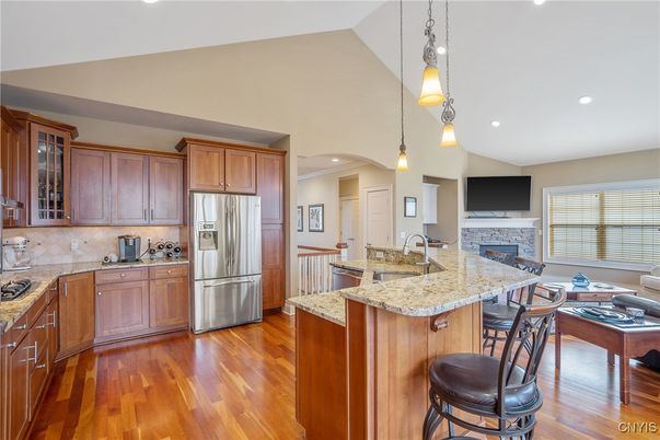 Fireplace, Interior, Kitchen, Pendant Lights, Recessed Lighting, Stainless Steel Appliances, Wood Texture Flooring