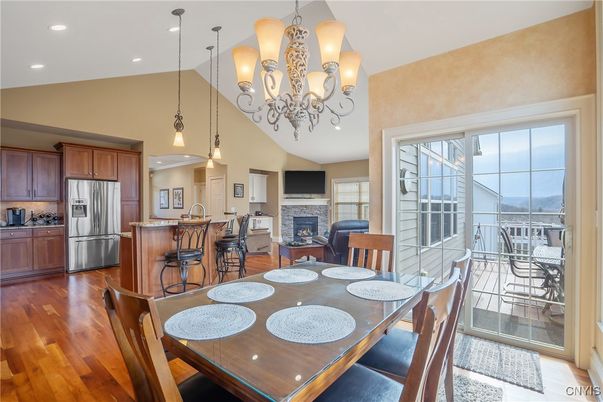 Chandelier, Dining room, Fireplace, Interior, Kitchen, Pendant Lights, Recessed Lighting, Stainless Steel Appliances, Wood Texture Flooring