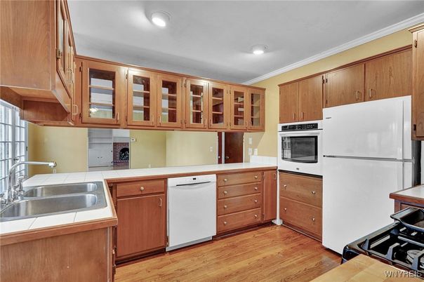 Interior, Kitchen, Recessed Lighting, Tile Countertops, Wood Texture Flooring