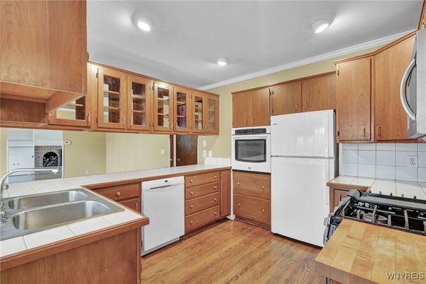 Interior, Kitchen, Recessed Lighting, Tile Countertops, Wood Texture Flooring