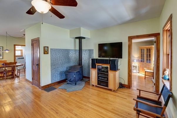 Dining room, Fireplace, Interior, Pendant Lights, Wood Texture Flooring