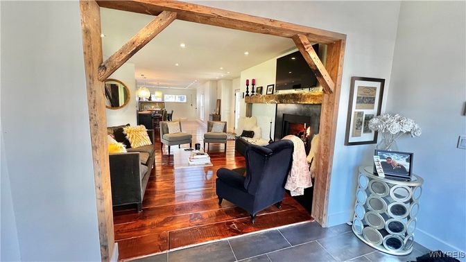 Dining room, Fireplace, Interior, Living room, Pendant Lights, Recessed Lighting, Wooden Beams, Wood Texture Flooring