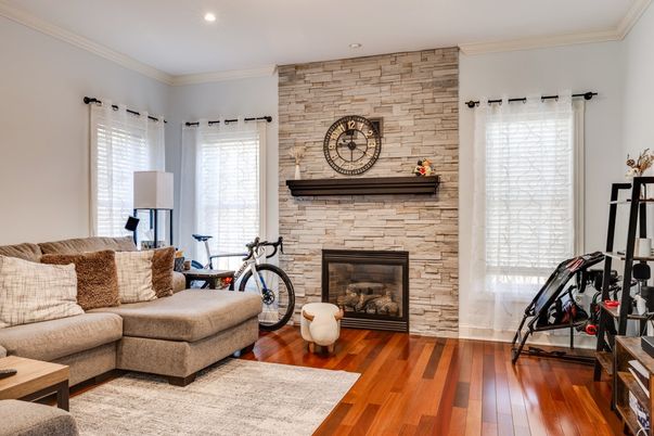 Fireplace, Fitness Equipment, Interior, Living room, Recessed Lighting, Stone Walls, Wood Texture Flooring